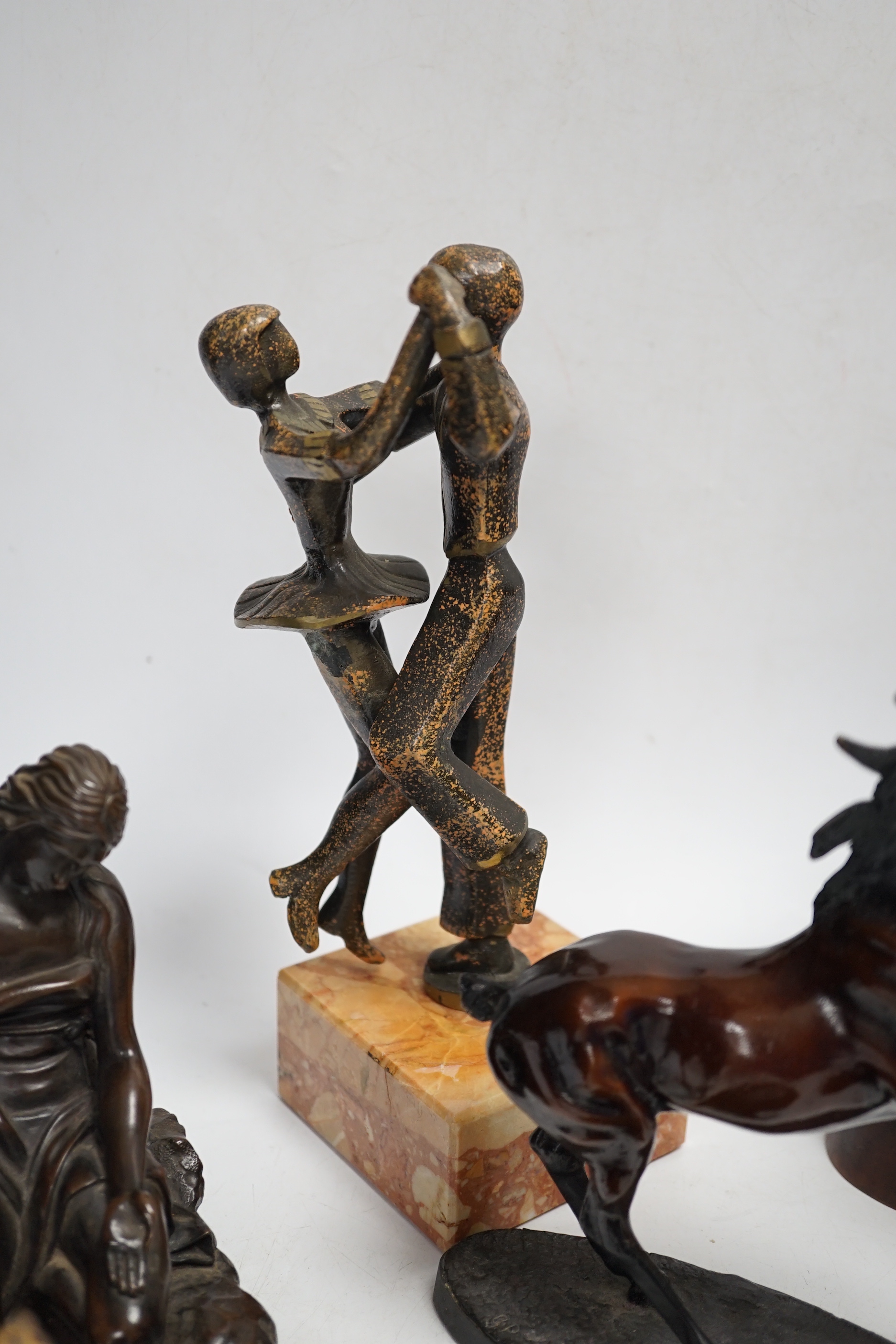 Mixed metal and carved ornaments, including a tortoise table bell, a statue of two dancers and a Balanese head, etc, 22cm